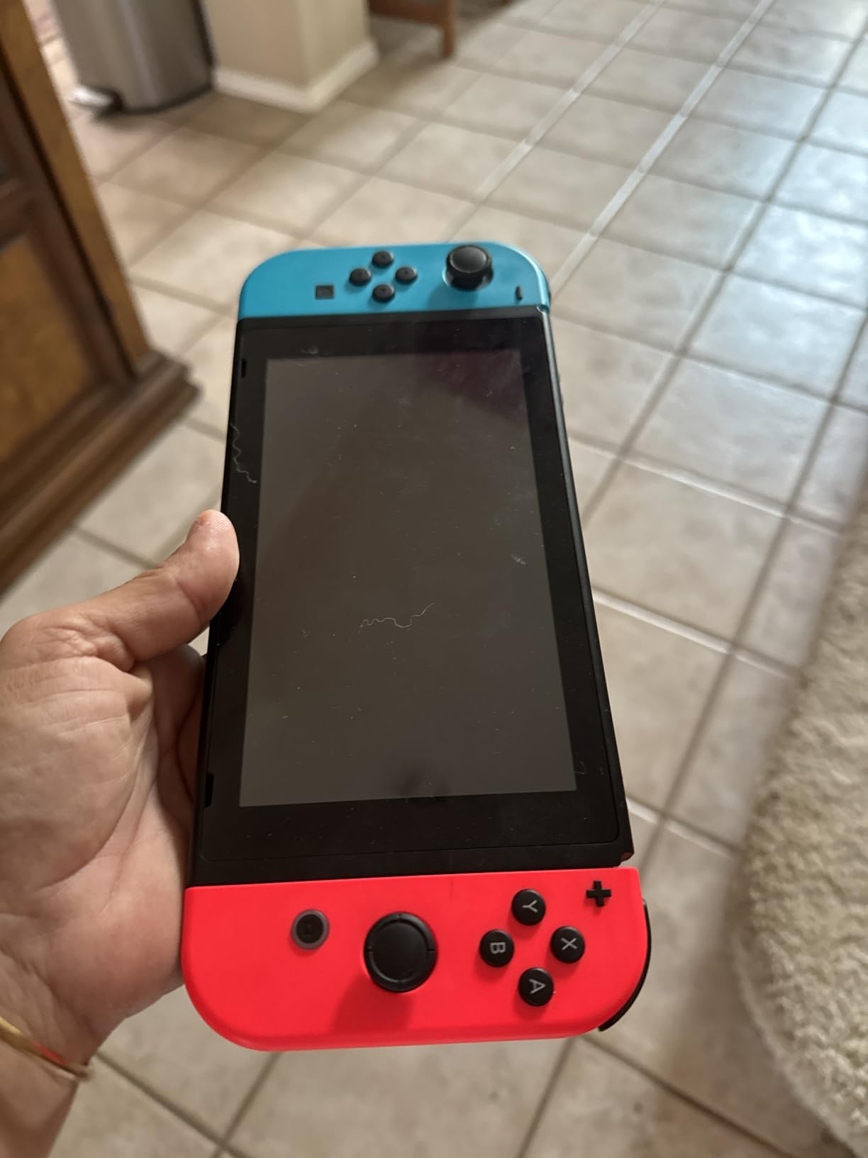 Nintendo Switch with Neon Blue and Neon Red Joy‑Con customer photo 1