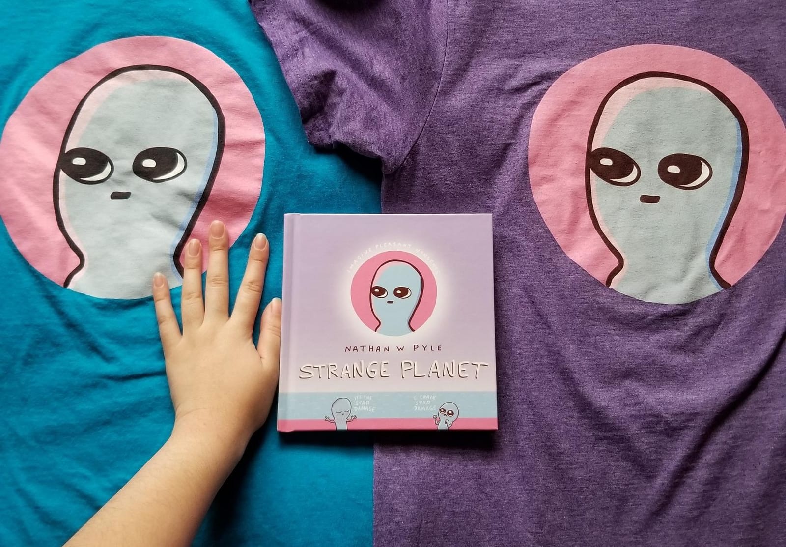 Strange Planet: Adorable pink-and-blue Beings navigate birth, school, work, and family life in this witty Instagram-famous comic collection. customer photo 1