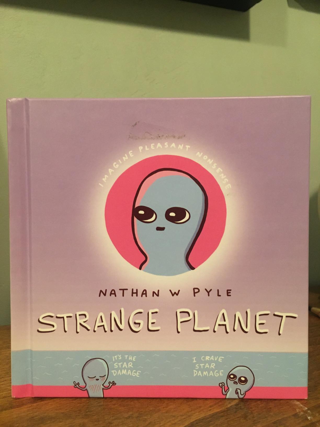 Strange Planet: Adorable pink-and-blue Beings navigate birth, school, work, and family life in this witty Instagram-famous comic collection. customer photo 2