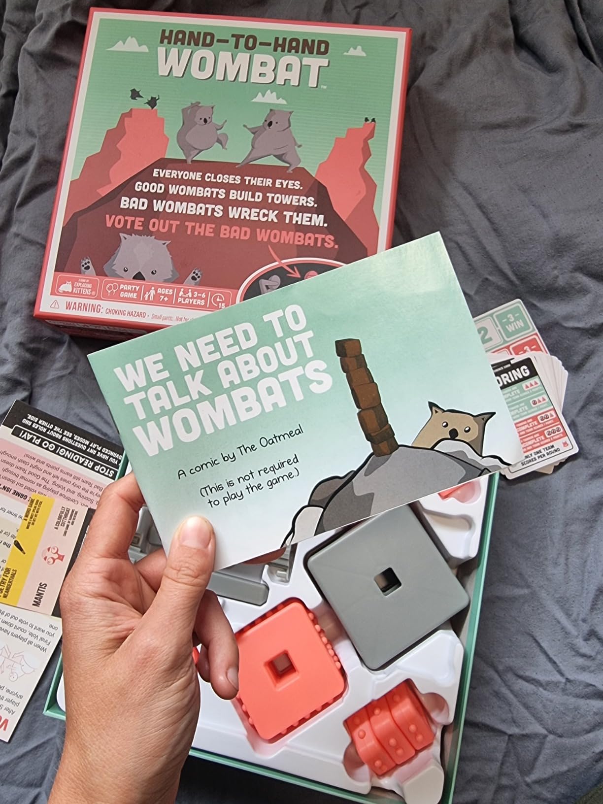Exploding Kittens Hand to Hand Wombat, 3-6 Players, Age 7+ | Build towers with your eyes closed, spot the secret saboteurs, and vote out the Wicked Wombats before they wreck it all! customer photo 1