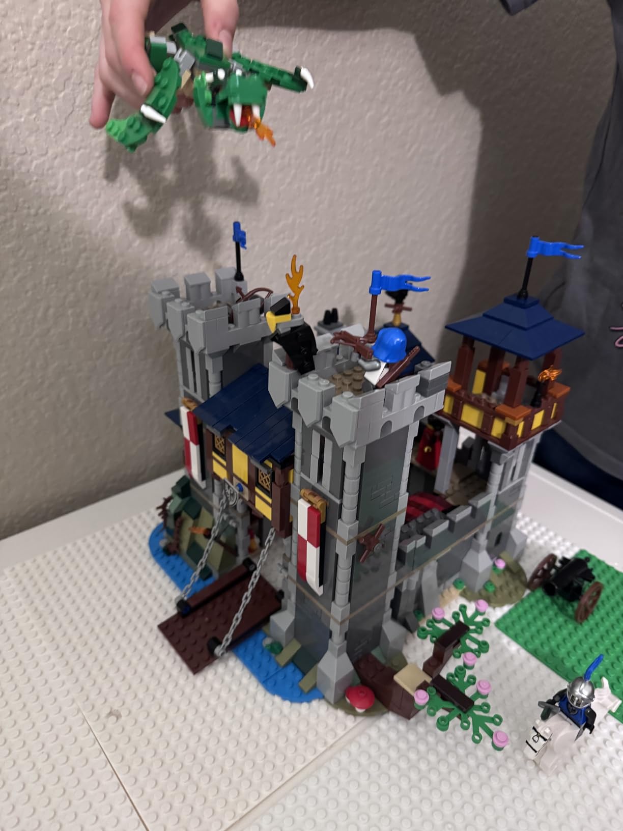 LEGO Creator 3 in 1 Medieval Castle Toy, Transforms from Castle to Tower to Marketplace, Includes Skeleton and Dragon Figure, with 3 Minifigures and Catapult, 31120 customer photo 1